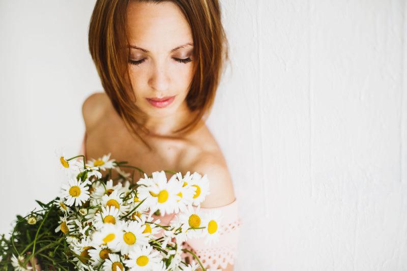 Elegant woman posing with a bouquet of flowers